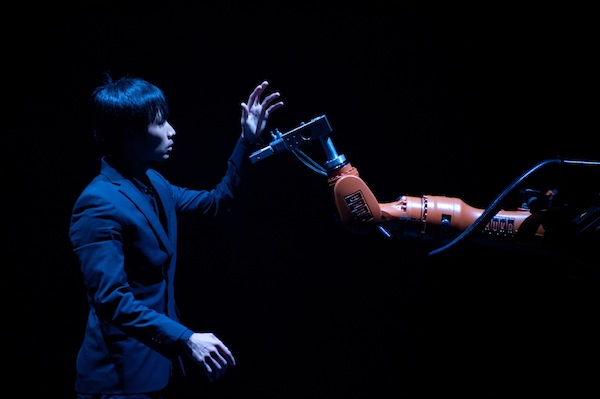 Huang Yi performs with his robot KUKA in HUANG YI & KUKA at 3LD Art & Technology Center. Photo by Summer Yen