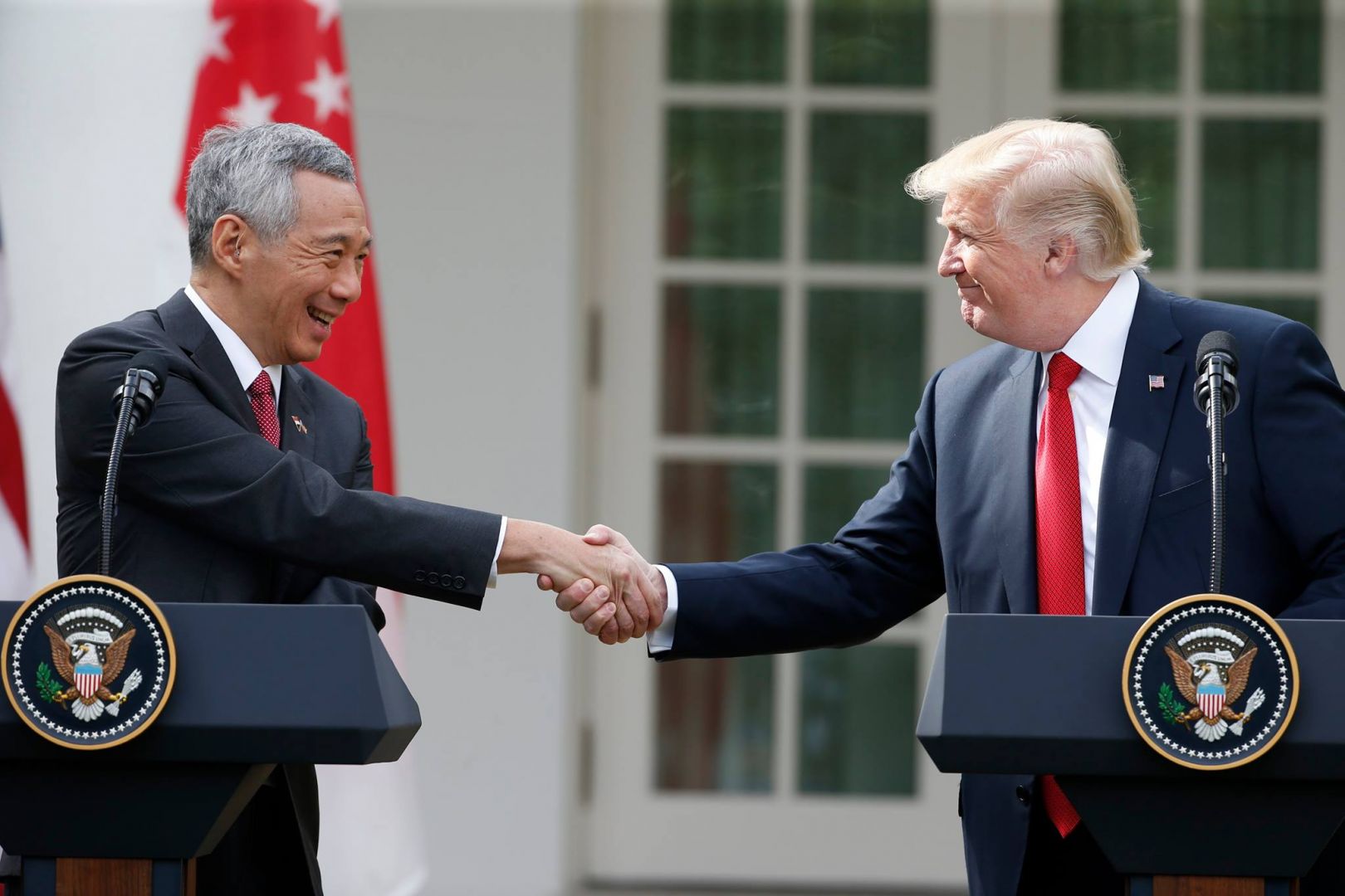 Trump and Singapore Prime Minister shake hands