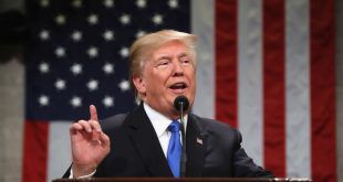 President Trump is pictured in front of the American flag during the 2018 State of the Union Address