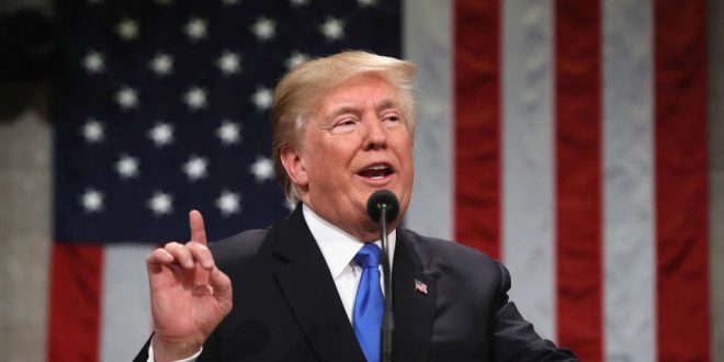 President Trump is pictured in front of the American flag during the 2018 State of the Union Address