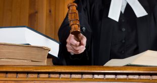 A judge hits the desk or bench with a Gavel during a trial.