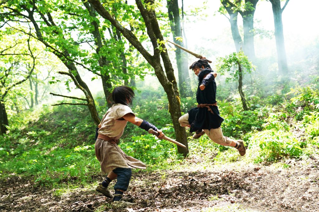 Piao and Li Xin practice sparring so one day they can no longer be slaves.