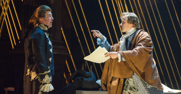 Photo of actors Ian Merrill Peakes as Antonio Salieri and Samuel Adams as Wolfgang Amadeus Mozart in 'Amadeus'