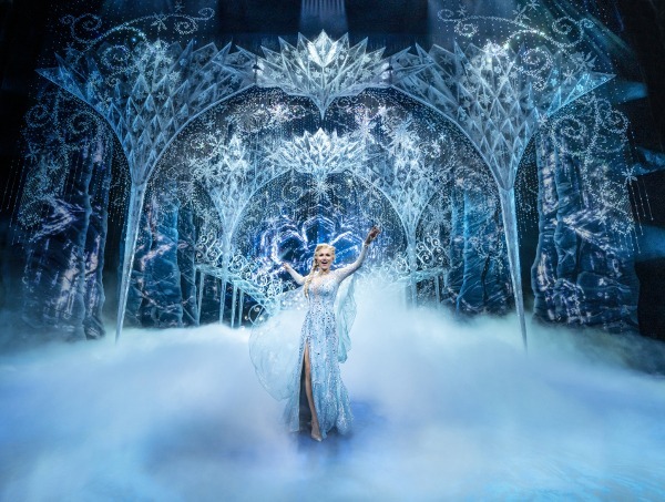 Photo of Samantha Barks as Elsa, standing on stage for a musical number in Disney's Frozen
