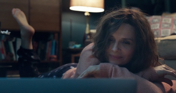 Photo of Juliette Binoche as Claire Millaud lying down