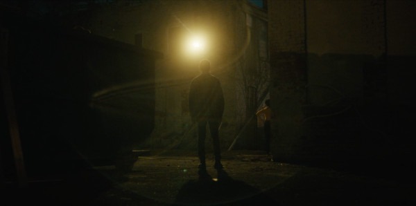 Still of Kash and Tanja standing outside the club talking