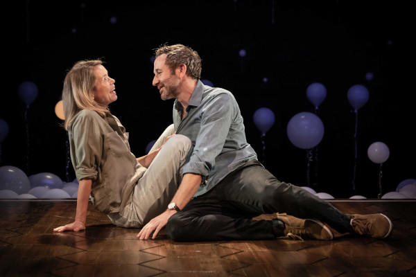 Photo of Anna Maxwell Martin and Chris O'Dowd sitting on the stage