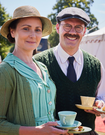 Photo of Anna Madeley and Will Thorp standing outside
