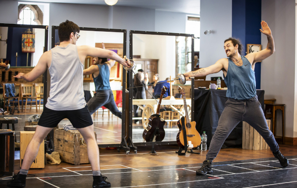 Photo of Benjamin Purkiss and Alex Gibson-Giorgio holding swords