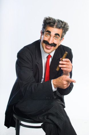 Photo of Frank Ferrante dressed as Groucho Marx and holding a cigar
