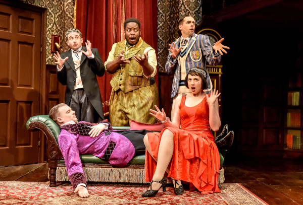 Photo of 'The Play That Goes Wrong' company gesturing dramatically
