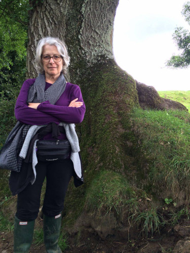 Petrea Burchard standing by a tree at Cadbury Hill UK