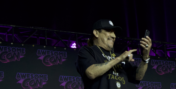 Photo of Danny Trejo holding a cell phone