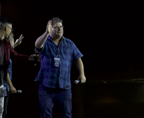 Photo of Sean Astin waving to fans at The Lord of the Rings panel