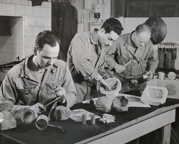 Photo of three men at a table