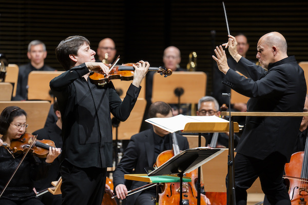 Jaap van Zweden leads the New York Philharmonic in the U.S. Premiere of 'The Elements' with combined works by Kevin Puts, Edgar Meyer, Jake Heggie, Jennifer Higdon, and Jessie Montgomery with soloist Joshua Bell and Copland's Third Symphony at David Geffen Hall, 9/29/2023. Photo by Chris Lee