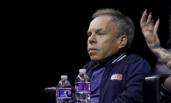 Photo of Warwick Davis looking into the audience