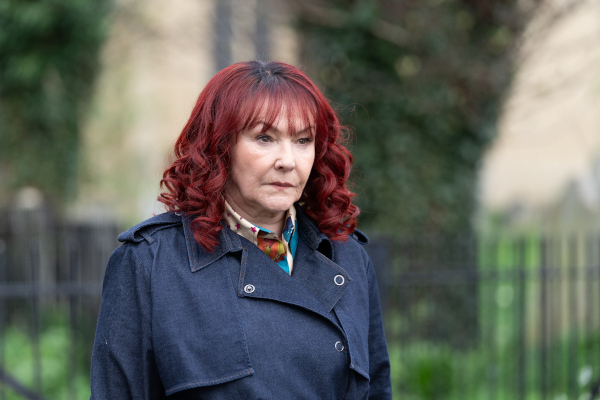 Woman in a blue trenchcoat