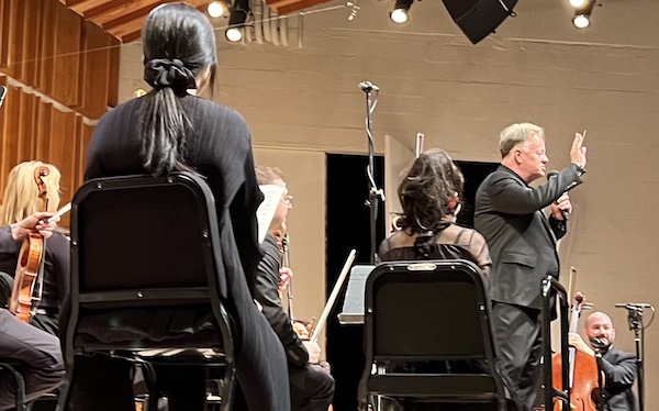 Maestro Justin Bischof addresses the audience during Modus Operandi Orchestra's all-Beethoven concert at Merkin Hall, NYC, March 12, 2025 (photo credit: Oren Hope)