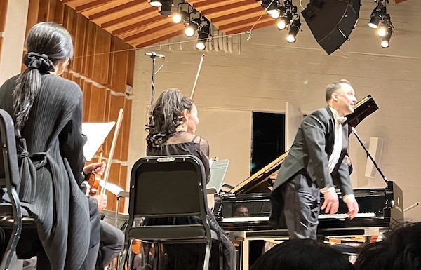 Pianist Alexandre Moutouzkine takes a bow during Modus Operandi Orchestra's all-Beethoven concert at Merkin Hall, NYC, March 12, 2025 (photo credit: Oren Hope)