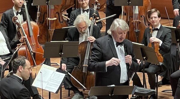 Thomas Crawford demonstrates themes of the music before the concert's official start