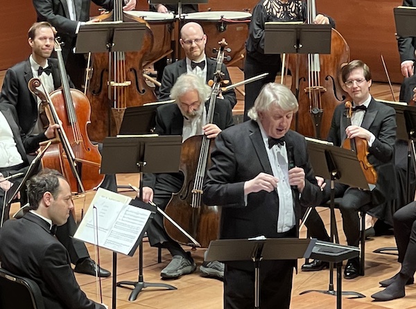 Thomas Crawford demonstrates themes of the music before the concert's official start