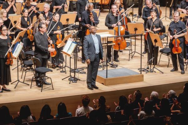 Composer James Lee III takes a bow with the Festival Orchestra of Lincoln Center, 'In Sickness and in Health,' August 2025 (Lawrence Sumulong)