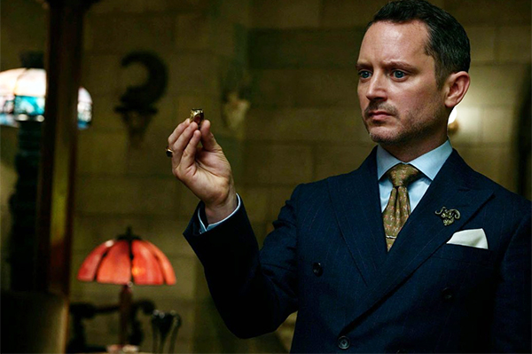 Elijah Wood as the domineering lawyer