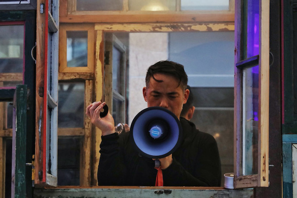 Ken Ueno with megaphone